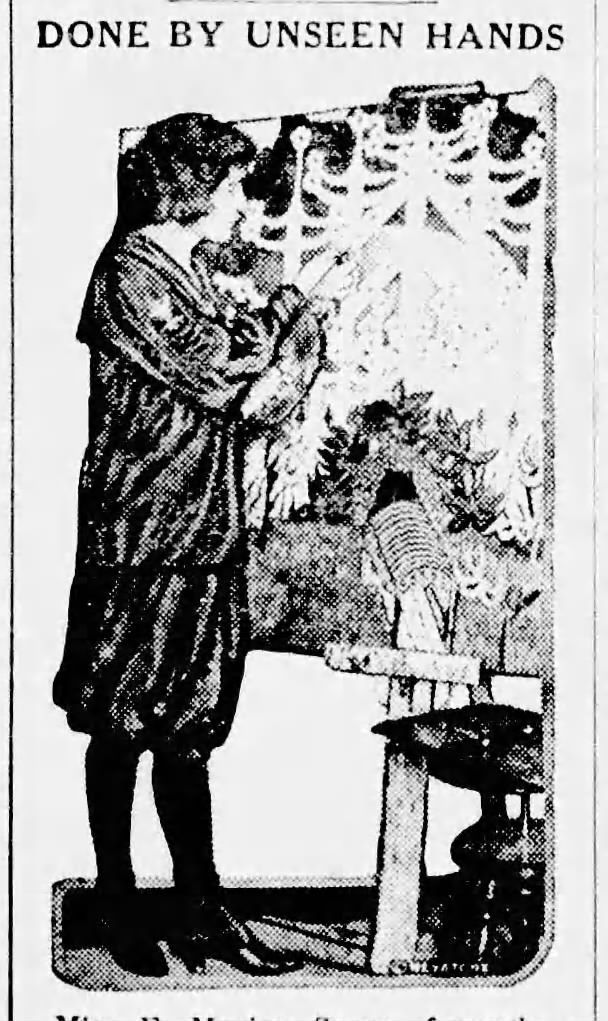 Marian Spore standing and painting The Temple of the Goddess of Flowers.